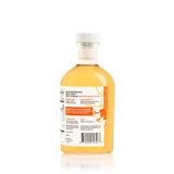 Bottle of Quince & Chardonnay Wine Vinegar with a label on a white background