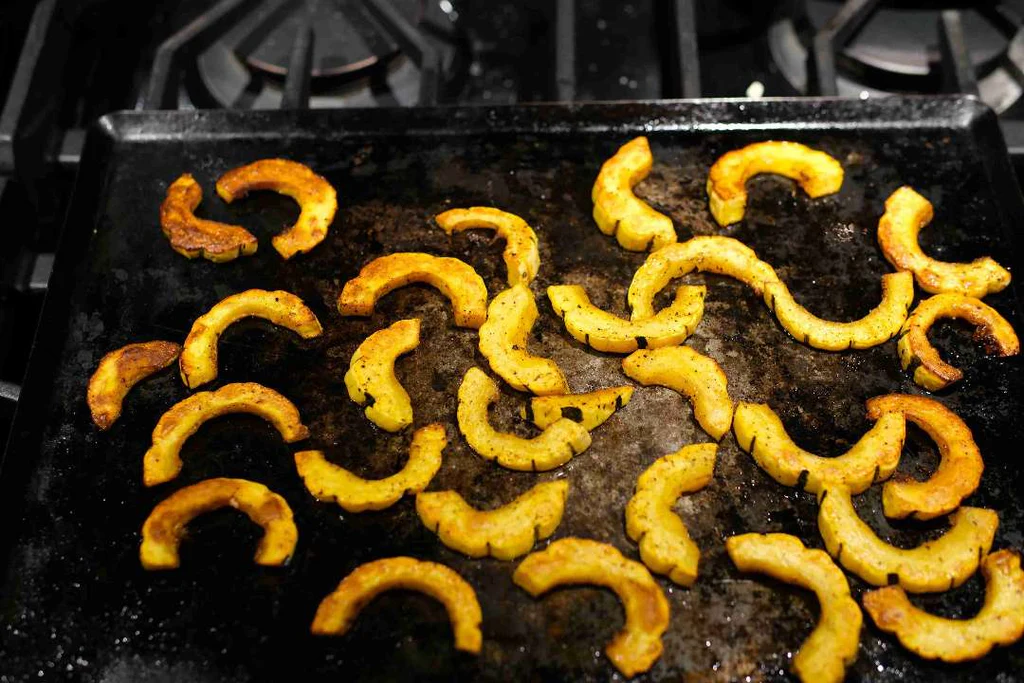 Roasted delicata squash tossed in California extra virgin olive oil by American Vinegar Works.