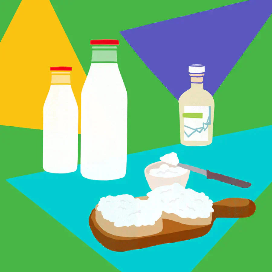 Ricotta spread on toast with milk bottles, vinegar, and a bowl with spoon on a geometric background