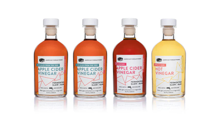 American Vinegar Works bottles: Apple Cider Vinegar; Cranberry; Hot Vinegar; Fermented Slow Raw.