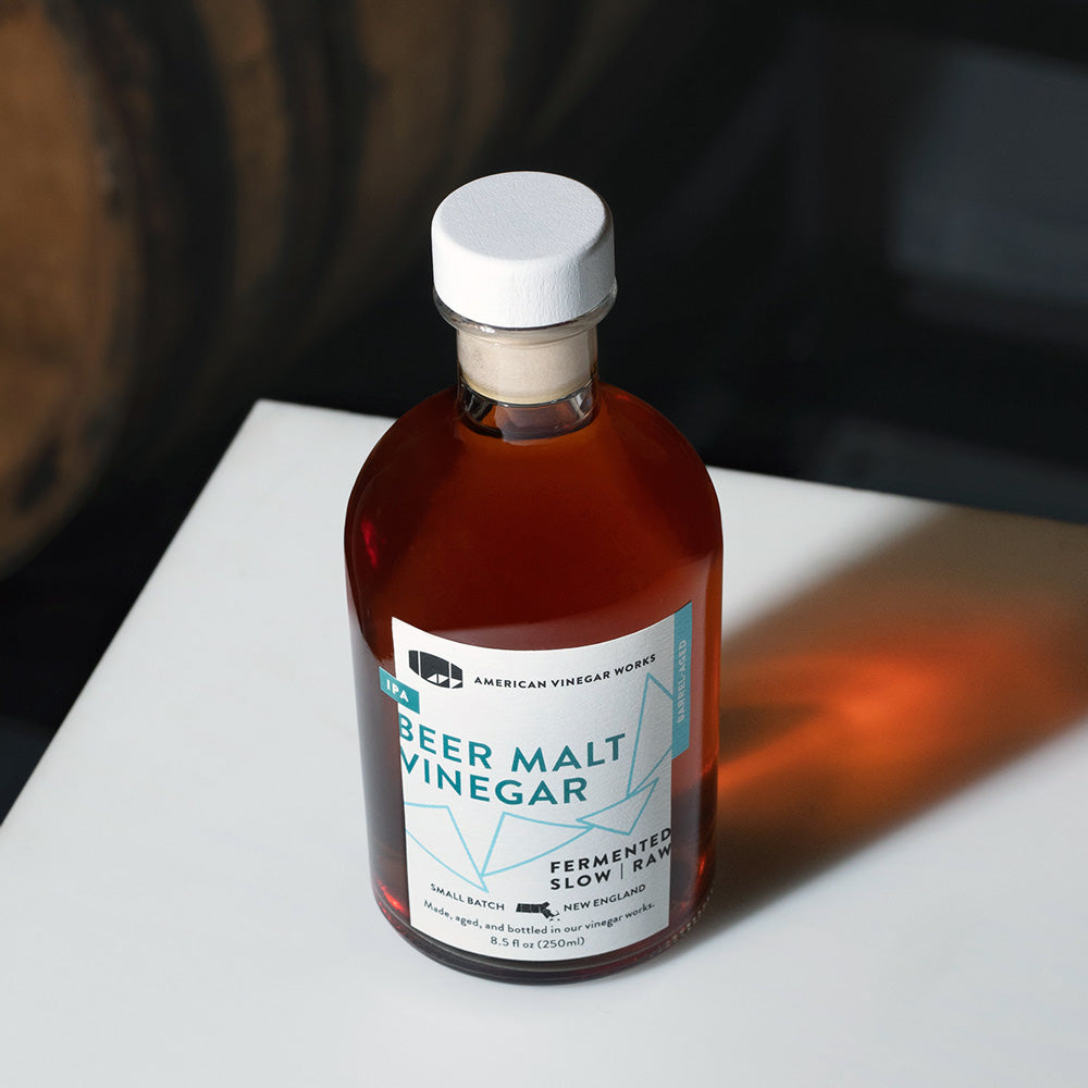 Bottle labeled 'IPA BEER MALT VINEGAR' AMERICAN VINEGAR WORKS FERMENTED SLOW RAW SMALL BATCH NEW ENGLAND 8.5 fl oz (250ml)
