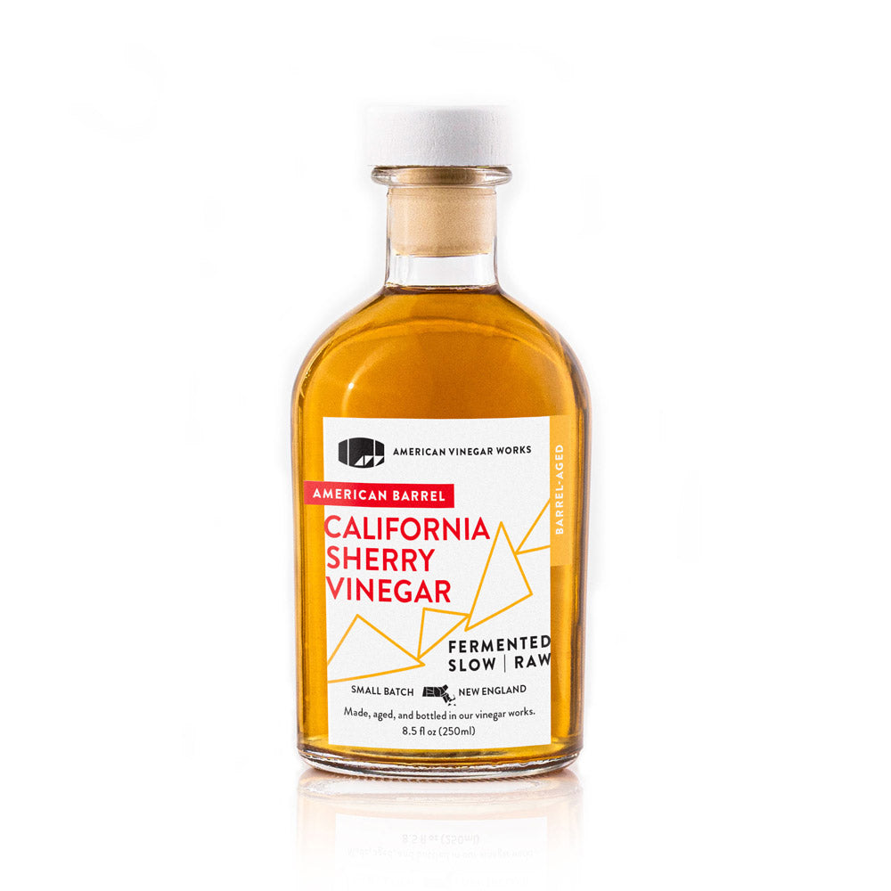 Front view of 8.5 fl oz American Vinegar Works California Sherry Vinegar bottle showing amber vinegar and white label