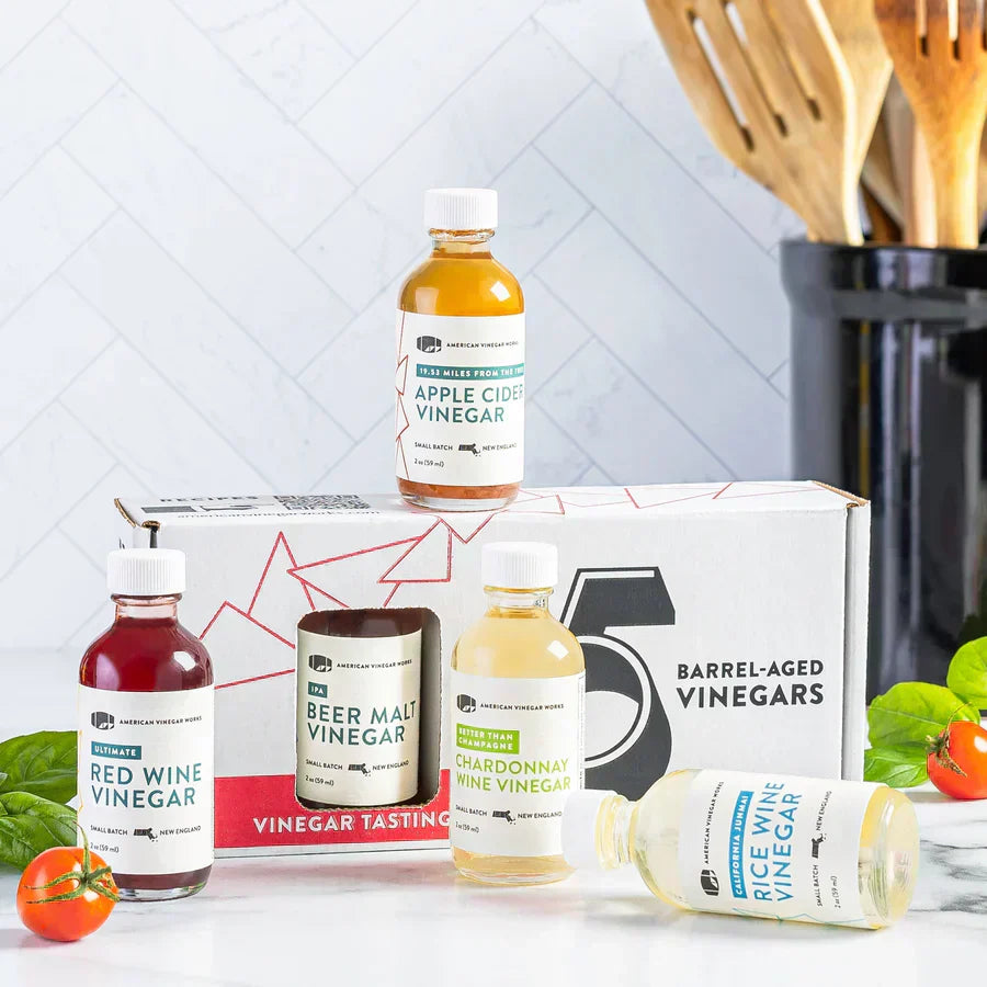 Front view of Essentials Plus sampler kit featuring five 2 oz mini vinegars with branded box.