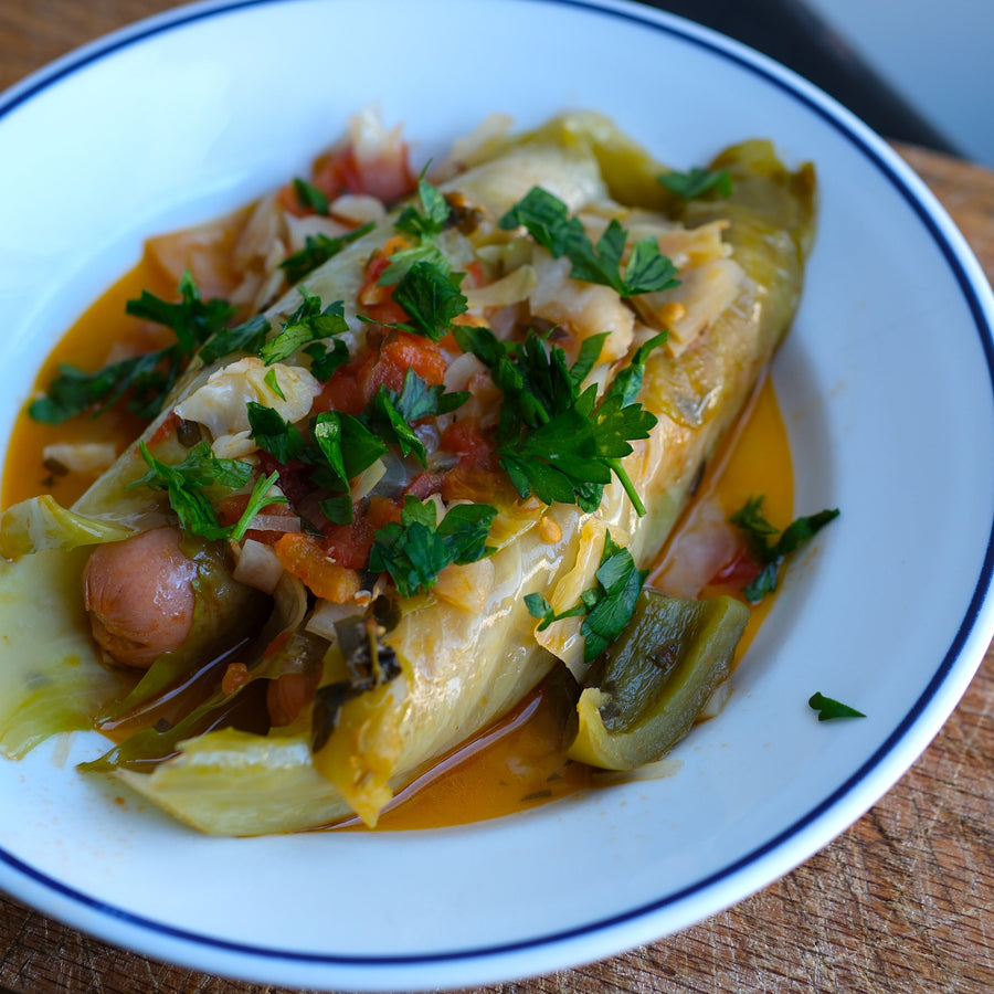 Cabbage and Hot dog rolls on white plate