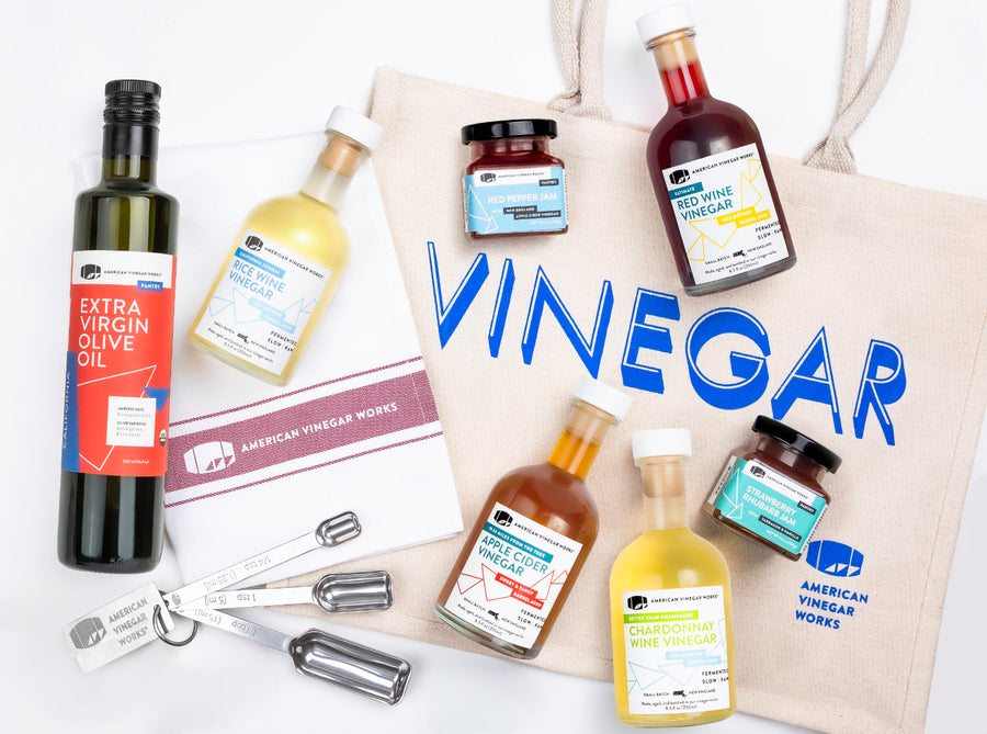 American Vinegar Works bundle: vinegar bottles, jam, and 'Vinegar' tote bag on white background.