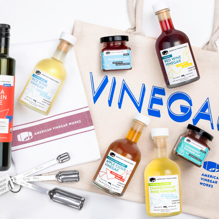 American Vinegar Works bundle consisting of vinegar bottles, jam, and a tote bag with 'Vinegar' text on a white background