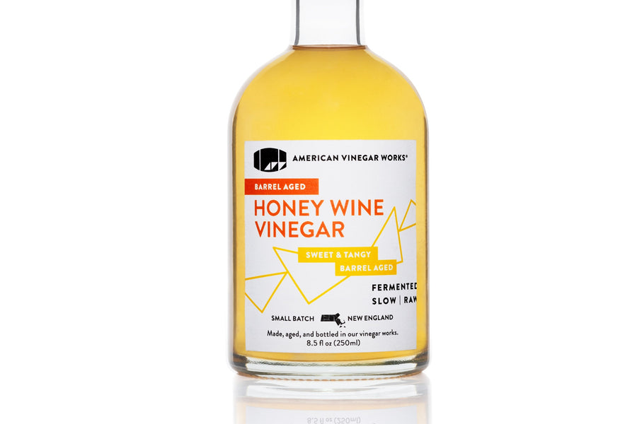 Front view of 250ml Barrel Aged Honey Wine Vinegar: white and orange label on white background.