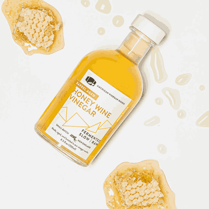 Honey wine Vinegar with honey comb in the background