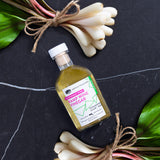 Ramp wine vinegar bottle on black surface with ramp bulbs around it