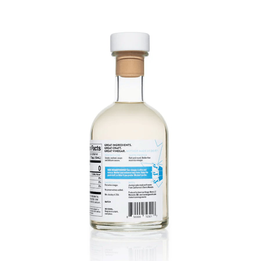 The back label of an American Vinegar Works California Junmai Rice Wine Vinegar bottle, showing nutrition facts, product description, ingredients, and a barcode.
