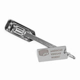 Stainless steel measuring spoons with the American Vinegar Works logo engraved on the handle tag.