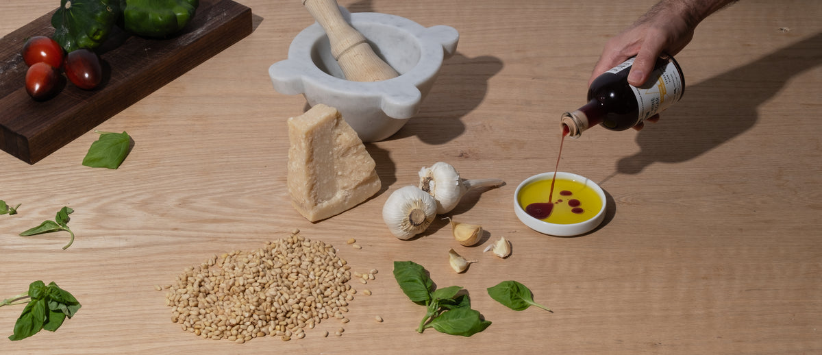 vinegar pouring into olive oil plate
