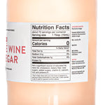 A close-up view of the back label for a large 1.1 Liter bottle of American Vinegar Works Pink Pacific Rosé Wine Vinegar, focusing on the Nutrition Facts panel showing about 72 servings and the text detailing select rosé wine made under the California sun.