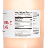 A close-up view of the back label for a large 1.1 Liter bottle of American Vinegar Works Pink Pacific Rosé Wine Vinegar, focusing on the Nutrition Facts panel showing about 72 servings and the text detailing select rosé wine made under the California sun.
