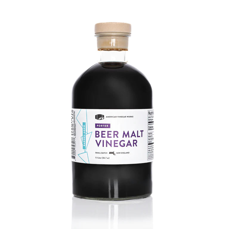 The front view of a large 1.1 Liter bottle of American Vinegar Works Porter Beer Malt Vinegar, featuring a wide white and purple label against a clean white background.
