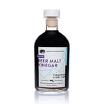 Front view of 8.5oz Porter Beer Malt Vinegar: dark liquid, white label with purple geometric lines.