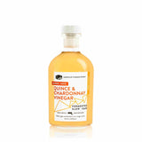 Front view of 8.5oz Quince & Chardonnay Vinegar: golden liquid, white and orange label on white.