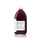 A detailed back view of a large 1 Liter bottle of American Vinegar Works Ultimate Red Wine Vinegar, focusing on the nutrition facts panel indicating about 67 servings, the ingredients list with spices, and details of bold, rich, and warm Shiraz from California.