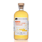 Barrel Aged honey wine vinegar bottle in a 1L size, front view on a white background