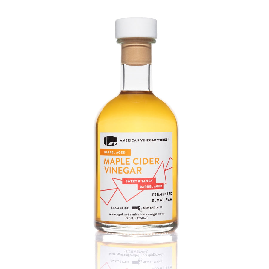 Front view of 250ml bottle of Maple Cider Vinegar with barrel-aged label on white background.
