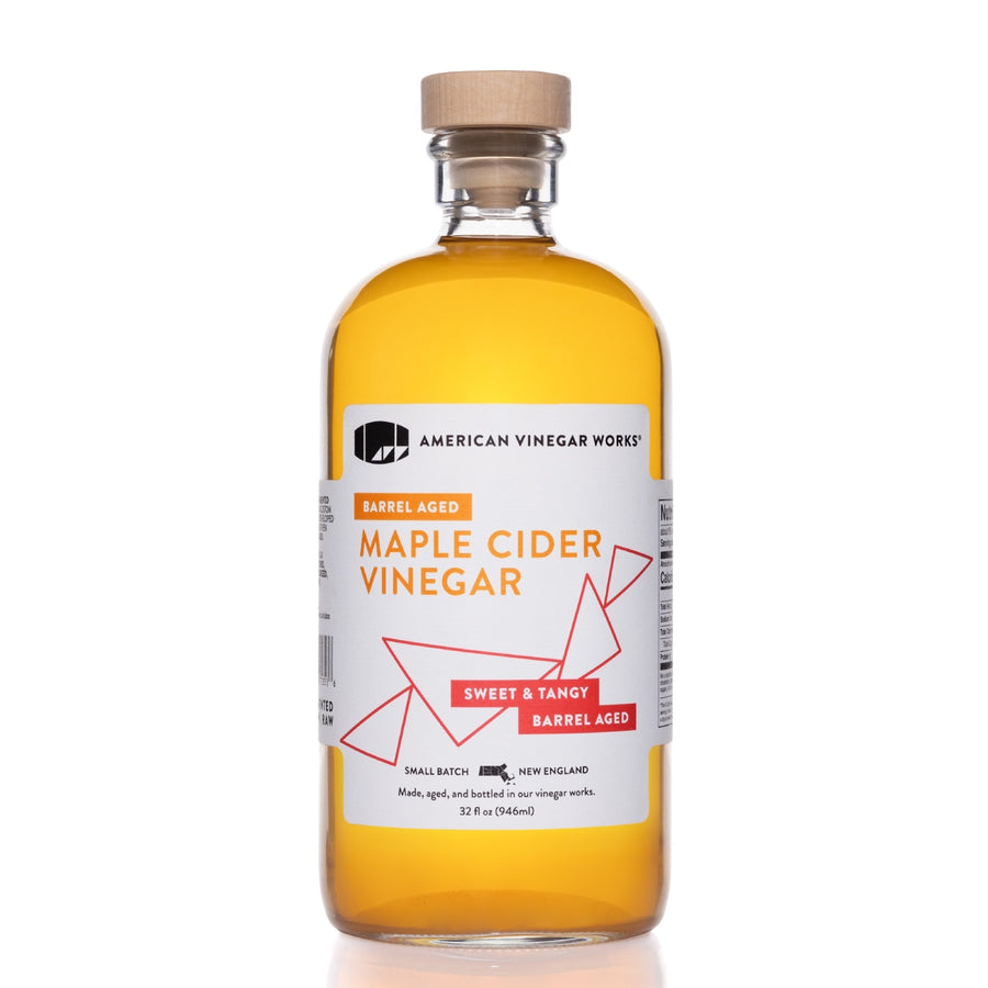 Front view of 1L bottle of Maple Cider Vinegar with barrel-aged label on white background.
