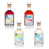 Four bottles of different types of vinegar on a white background