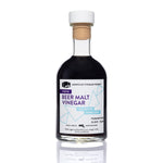 Beer Malt Vinegar dark glass bottle on white background — artisanal malt vinegar